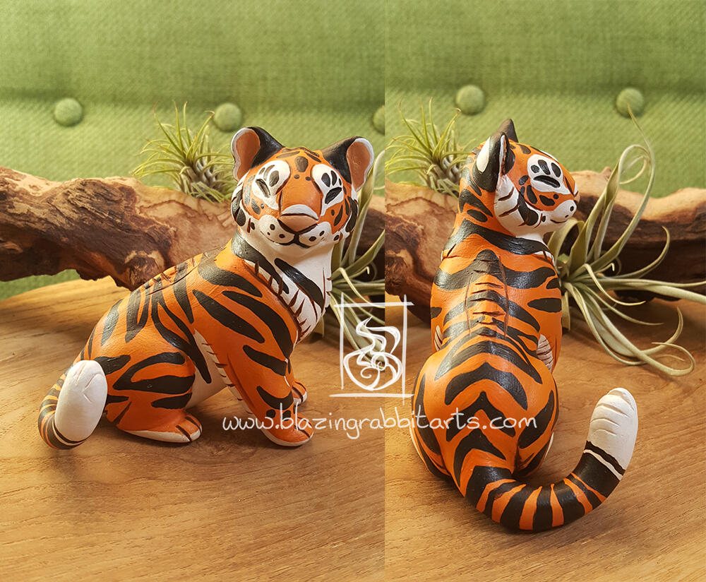 Tiger Sculpture of a tiger sitting.