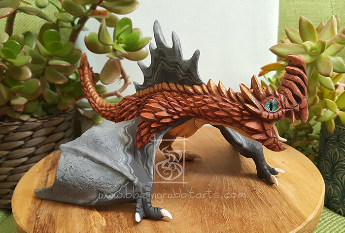 Chimney Wyvern Sculpture of a spiky copper wyvern.
