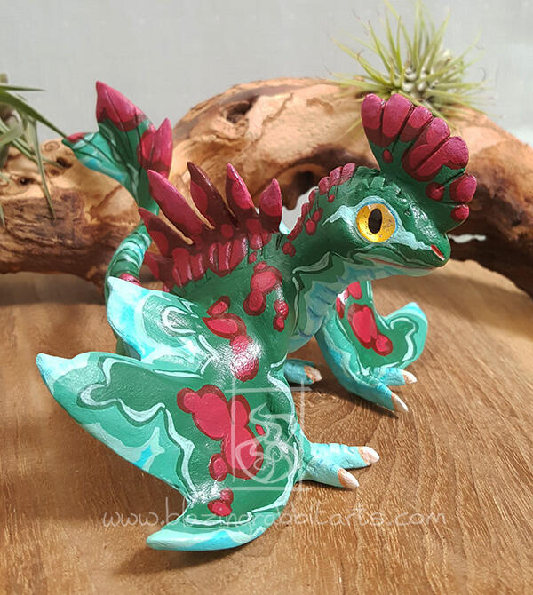 Malachite Wyvern Sculpture of a wyvern in the colors of malachite.